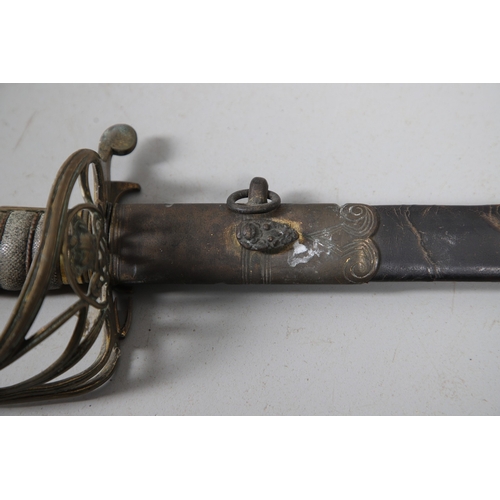 96 - A VICTORIAN 1854 PATTERN SWORD AND SCABBARD. An 1854 pattern sword with an 82 cm tapering, pointed p... 