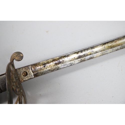 98 - A VICTORIAN 1854 PATTERN SWORD AND SCABBARD BY CATER AND CO. An 1854 pattern sword with an 83 cm sle... 