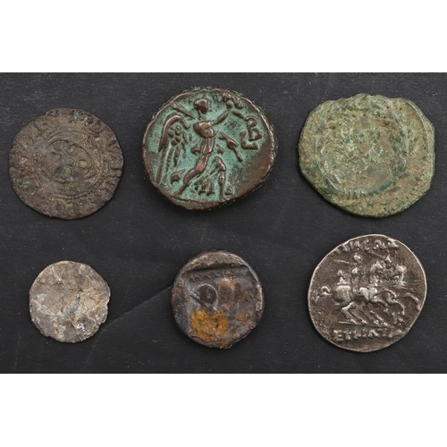 1005 - A SMALL COLLECTION OF ANCIENT COINS INCLUDING A GREEK COIN FROM RHODES AND OTHERS. A Greek coin, bus... 