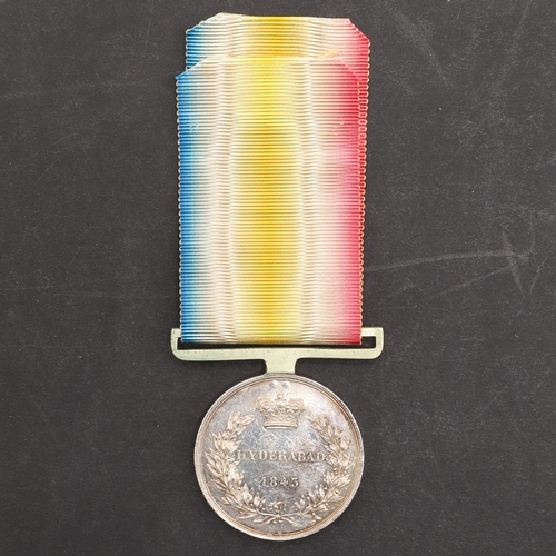 806 - A SCINDE MEDAL, HYDERABAD 1843. A Scinde medal with Hyderabad 1843 reverse, named to Chutursal Sing ... 