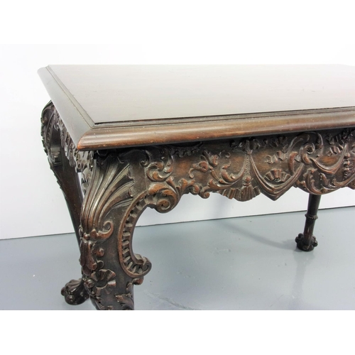 25 - A FINE 19TH CENTURY RECTANGULAR TOP TABLE, PROBABLY IRISH, HAVING A HEAVILY CARVED FRIEZE CENTRED WI... 