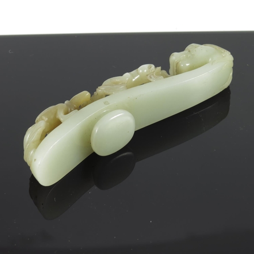 459 - QING DYNASTY CARVED JADE BELT HOOK, APPROX. 13cm L.