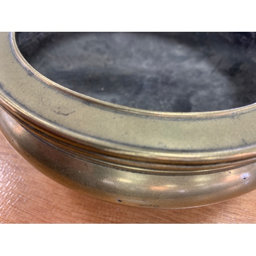 450 - ORIENTAL POLISHED BRONZE CENSER APPROX 16.5CMS DIAMETER RAISED ON 3 FEET OVERALL HEIGHT APPROX. 5.5C... 