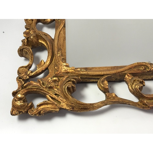 97 - GOOD QUALITY PIERCED GILT FRAMED MIRROR, APPROX. 88 X 68 cm