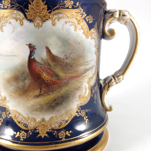 142 - LARGE ROYAL WORCESTER 2 HANDLED TANKARD PAINTED WITH PHEASANTS SIGNED STINTON WITH HAIRLINE CRACK, A... 