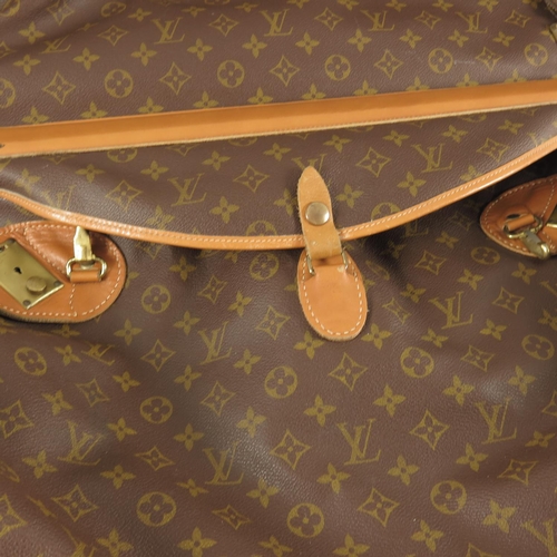 394 - LOUIS VUITTON VINTAGE SUITCASE/CLOTHES HANGER. DATING FROM THE LATE50S OR EARLY 60S. COMPETE WITH ... 