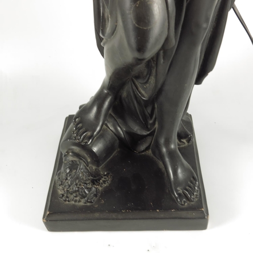 403 - REGENCY BLACK PAINTED FIGURAL TORCHERE MODELLED IN PLASTER AS A CLASSICAL MAIDEN HOLDING A LAMP, BAS... 