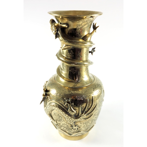 453 - CHINESE QUING STYLE POLISHED BRONZE VASE WITH RELIEF DRAGON DECORATION ON A HARDWOOD STAND