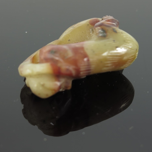 456 - CHINESE CELADON AND RUSSET JADE DEPICTING A RECUMBENT MONKEY, APPROX. 4 X 3.6 cm