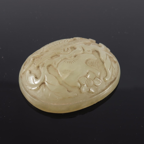 468 - CHINESE QING DYNASTY PALE GREEN JADE PANEL OF OVAL FORM DEPICTING A DECORATIVE URN AND FLOWERING LOT... 