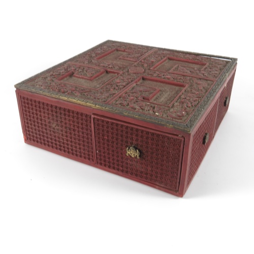 460 - AN INTRICATELY CARVED CHINESE CINNEBAR LACQUERED TREASURE BOX INCORPORATING DRAWERS, APPROX. 21 cm S... 