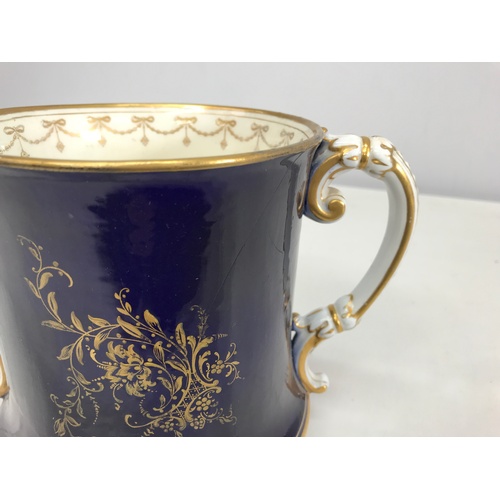 142 - LARGE ROYAL WORCESTER 2 HANDLED TANKARD PAINTED WITH PHEASANTS SIGNED STINTON WITH HAIRLINE CRACK, A... 