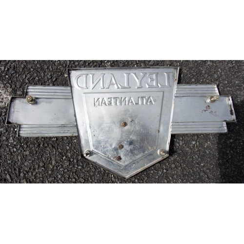 36 - LEYLAND ATLANTEAN BUS BADGE, WITH THE WINGED EMBLEM AND ENAMELLED ATLAS / ATLANTEAN GOD WITH THE WOR... 