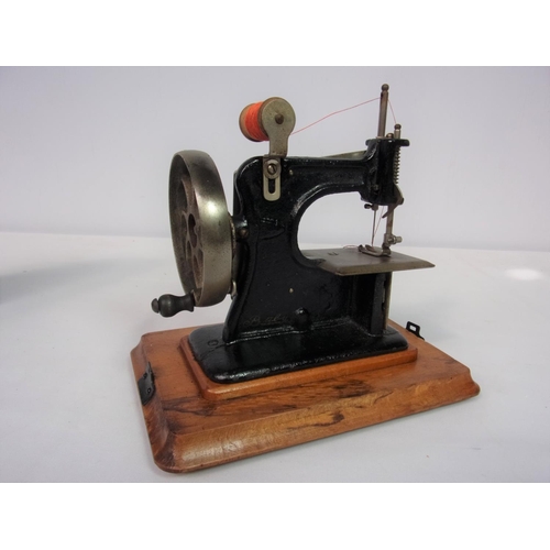 55 - ANTIQUE BABY CHILDS SEWING MACHINE POSSIBLY CIRCA 1920S MADE IN GERMANY AND WERE ORIGINALLY WE ARE A... 