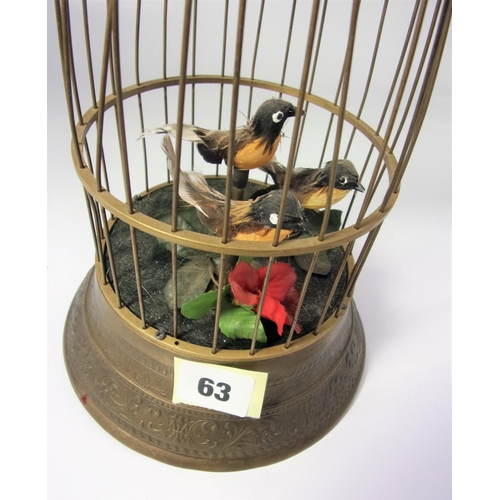 63 - BRASS EFFECT CLOCKWORK  HANGING CENTREPIECE WITH 3 BIRDS IN A SMALL CAGE