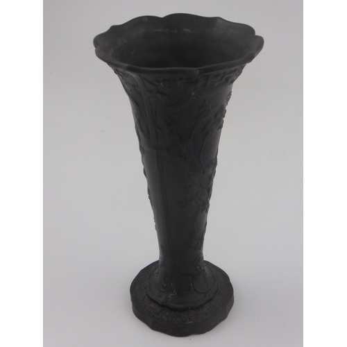 707 - EARLY WEDGWOOD BLACK BASALT TRUMPET VASE WITH RELIEF FLORAL DECORATION AND FLUTED RIM APPROX 25 cm A... 