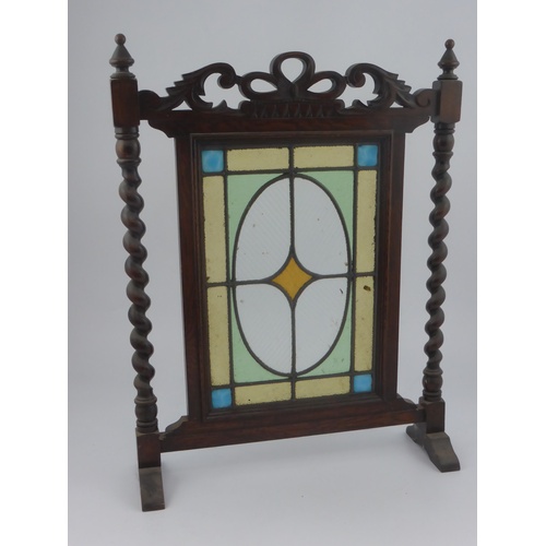 870 - FIRESCREEN WITH BARLEY TWIST SUPPORTS AND STAINED GLASS PANEL