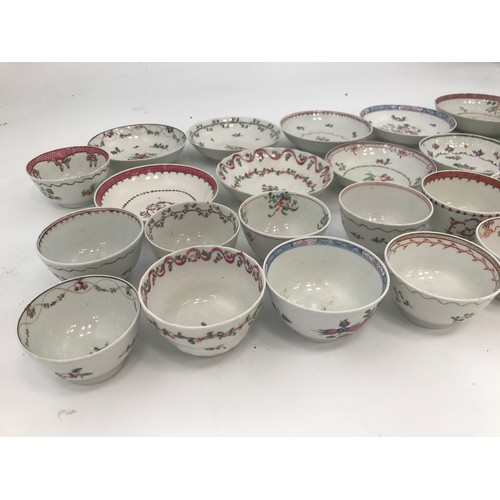 800 - A COLLECTION OF ANTIQUE TEA BOWLS AND SAUCERS