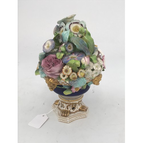 712 - POSSIBLY DERBY FLOWER VASE OF URN FORM WITH BOUQUET OF PORCELAIN FLOWERS AF