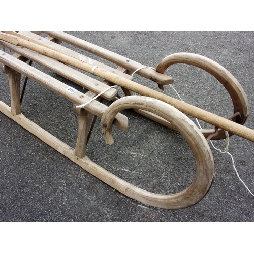 58 - WOODEN SLEIGH AND HAY RAKE