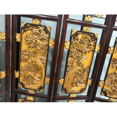 444 - ORIENTAL 4 FOLD SCREEN WITH INTRICATELY CARVED RELIEF DECORATED PANEL