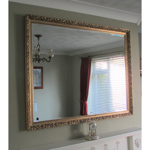 625 - LARGE BEVELLED MIRROR WITH ORNATE GILT FRAME