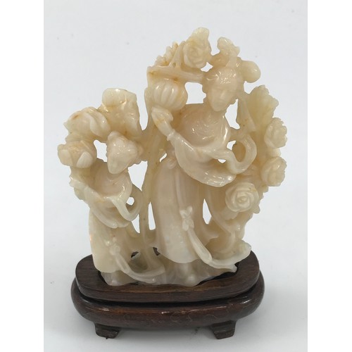 1969 - CARVED OPAL FIGURE GROUP DEPICITNG MOTHER AND DAUGHTER WITH FLOWERS APPROX 10 cm ON HARDWOOD PRESENT... 