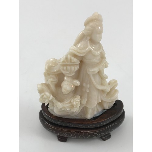 1971 - CARVED OPAL FIGURE GROUP DEPICITNG LADY WITH CHILD AND FLOWERS APPROX 9 cm ON HARDWOOD PRESENTATION ... 