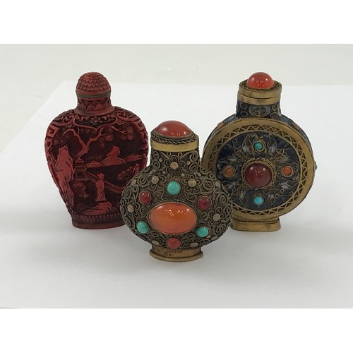 1770 - 2 JEWELLED SNUFF BOTTLES TOGETHER WITH A CARVED RED CINNABAR SNUFF BOTTLE