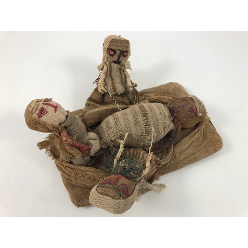 1710 - 2 ETHNIC TRIBAL STRAW FILLED CLOTH DOLLS ONE DEPICTING A FEMALE APPROX 25 cm THE OTHER A VERY UNUSUA... 