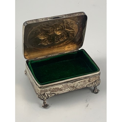 1856 - SILVER TRINKET BOX WITH EMBOSSED ANGEL DECORATION TO THE HINGED LID