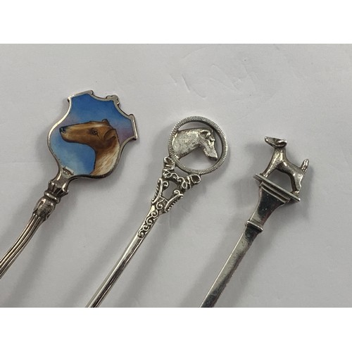 1952 - 7 SILVER TEA SPOONS WITH TERRIER FINIALS 1 OTHER WITH ENAMELLED TERRIER DECORATION AND 1 OTHER