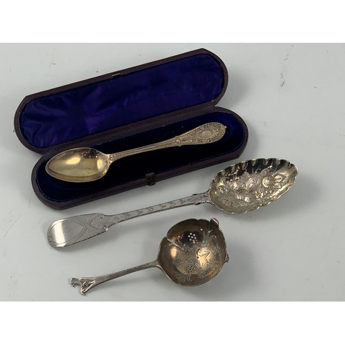 1933 - SILVER BERRY SPOON, ENGRAVED SPOON IN PRESENTATION CASE AND A STRAINER, APPROX. 144g