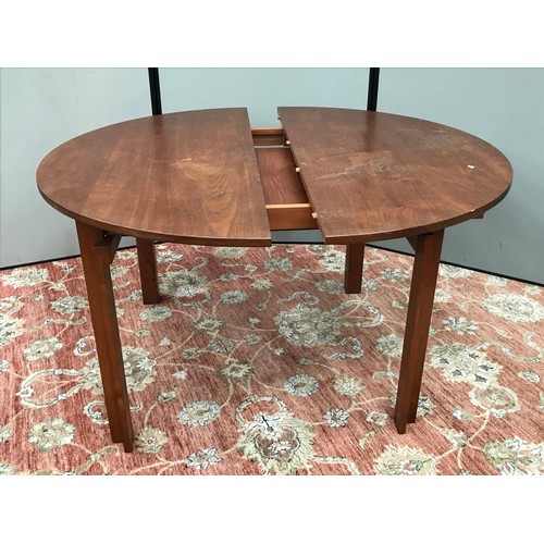 414 - TEAK EXTENDING DINING TABLE AND 6 CANE SEATED CHAIRS