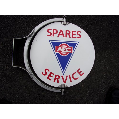 20 - A REPRO AEC SPARES AND SERVICE ROTATING SIGN ON SUBSTANTIAL BRACKET APPROX. 18 INCH DIAMETER SIGN