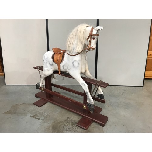 2 - LARGE WHITE ROCKING HORSE WITH LEATHER STYLE SADDLE, HEAVY HINGES, MANE AND TAIL APPROX. 46 INCHES H... 