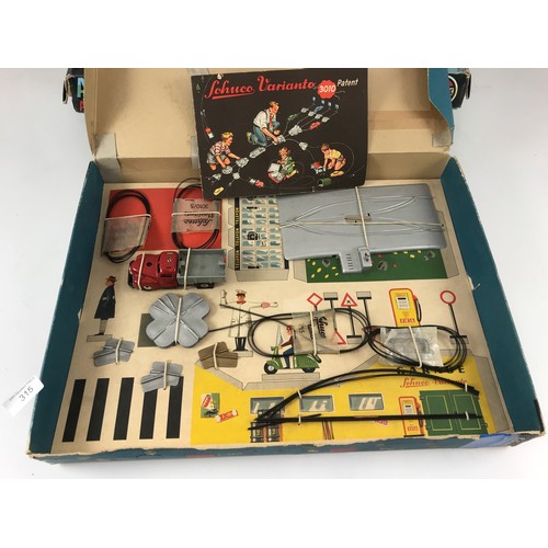 315 - SCHUCO, A VARIANTO 3010 ELECTRIC AUTOMOBILE GAME WITH AUTOMATIC STEERING IN VGC, BOXED CONDITION, PL... 