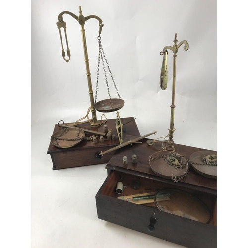 1151 - 2 SETS OF OLD AVERY, MAHOGANY CASED, APOTHECARY BALANCE SCALES, EACH WITH A DRAWER, ACCESSORIES, WEI... 