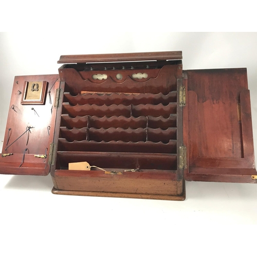 1159 - VICTORIAN MAHOGANY STATIONARY CABINET WITH SLOPING FRONT AND HINGED DOUBLE DOORS, FITTED INTERIOR