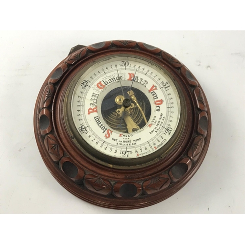 1168 - ANEROID BAROMETER IN ROUND WOODEN FRAME