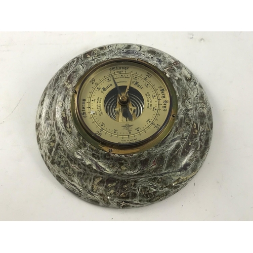 1169 - ANEROID BAROMETER IN SERPENTINE MOUNT