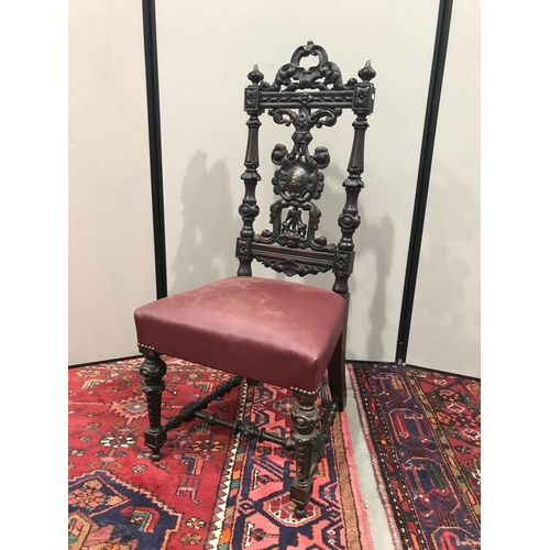 393 - CARVED ANTIQUE ARMORIAL CHAIR