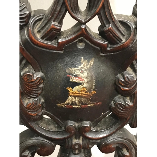 393 - CARVED ANTIQUE ARMORIAL CHAIR