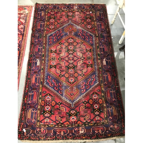 401 - RED AND BLUE GROUND RUG APPROX 210CM X 130cm