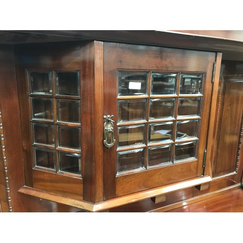 11 - ARTS AND CRAFTS STYLE MAHOGANY SIDE BOARD WITH BEVELLED MULTI PANE GLAZED DISPLAY SECTION ABOVE