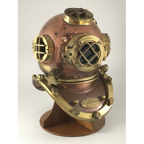 420 - LARGE REPRODUCTION BRASS AND COPPER DIVER'S HELMET ON DISPLAY PLINTH