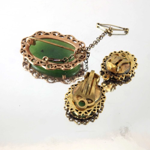 806 - POSSIBLY JADE CABOCHON BROOCH AND PR. MATCHING CLIP ON EARRINGS