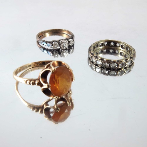 779 - 3 RINGS, 9ct GOLD RING SET WITH 3 WHITE STONES, 9ct GOLD DRESS RING AND AN ETERNITY RING