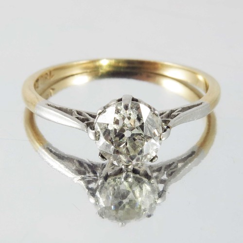 767 - DIAMOND SOLITAIRE STONE APPROX. 0.9 CARATS ON AN 18 CARAT YELLOW GOLD AND PLATINUM BAND