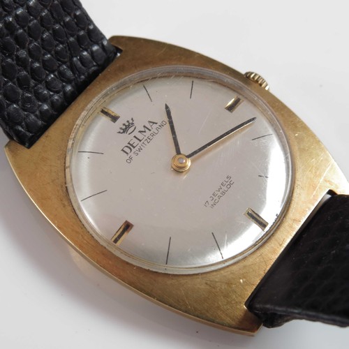 830 - 18ct GOLD CASED GENTS VINTAGE DELMA WRIST WATCH